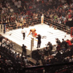 Two MMA fighters grappling during a professional bout